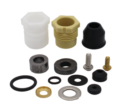 White and tand plastic bonnet nuts black rubber seals washers o-rings round grey graphite packings stainless screw and washer with bright brass retainer cup and brass screw.