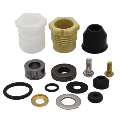 White and tand plastic bonnet nuts black rubber seals washers o-rings round grey graphite packings stainless screw and washer with bright brass retainer cup and brass screw.
