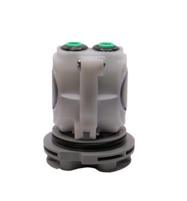 White plastic body with black and green o-rings and washers with grey bottom.