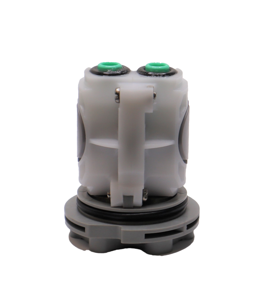 White plastic body with black and green o-rings and washers with grey bottom.