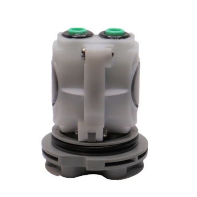 White plastic body with black and green o-rings and washers with grey bottom.