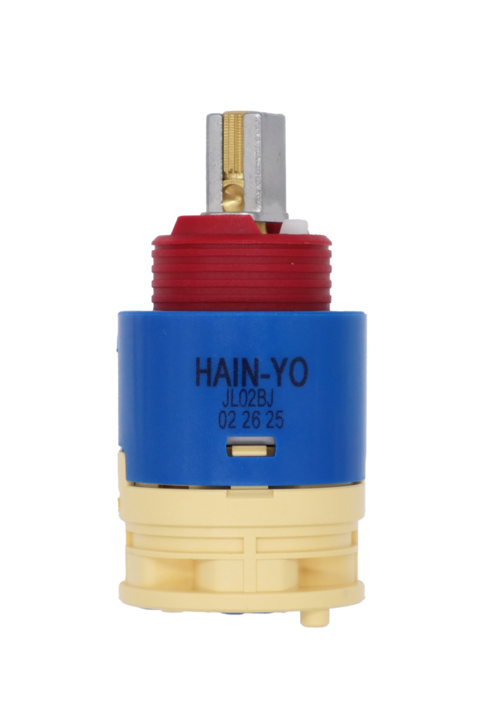 Bright blue plastic cartridge with red limit stop brass stem and metal handle adapter with tan bottom and blue seal.