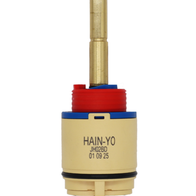 Tan and blue plastic cartridge with red limit stop brass stem and black rubber seals.