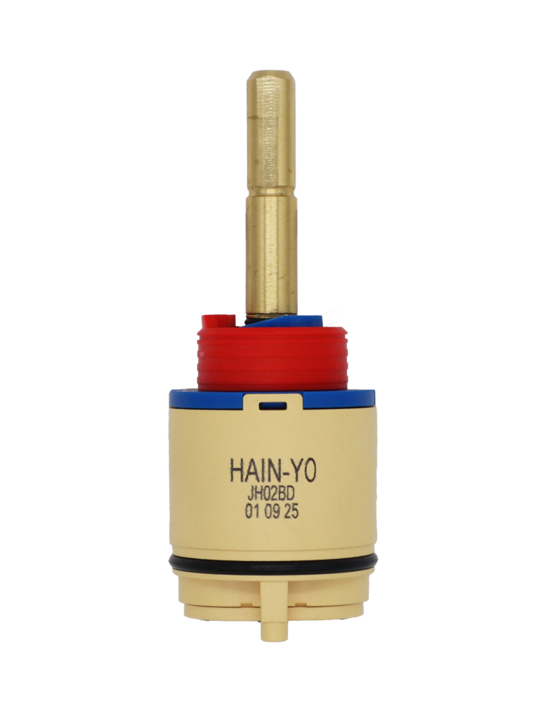 Tan and blue plastic cartridge with red limit stop brass stem and black rubber seals.