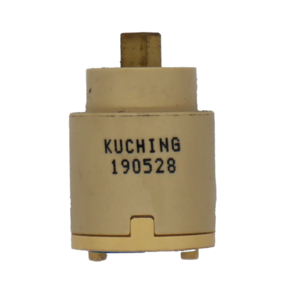 Tan plastic cartridge with square brass handle connection blue rubber bottom seals and kuching stamped on side.