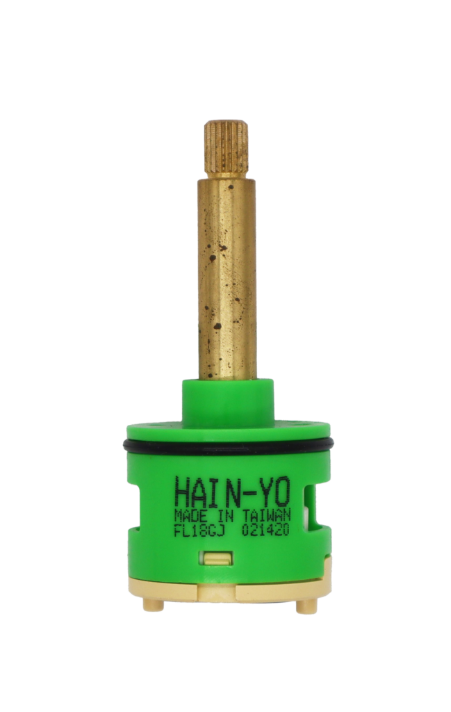Lime green and tan cartridge with brass stem black rubber o-ring and blue rubber seals.