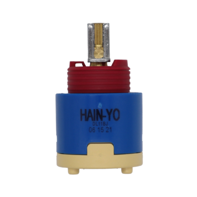 Blue and tan plastic cartridge with red limit stop brass and metal handle connection with blue rubber seal.