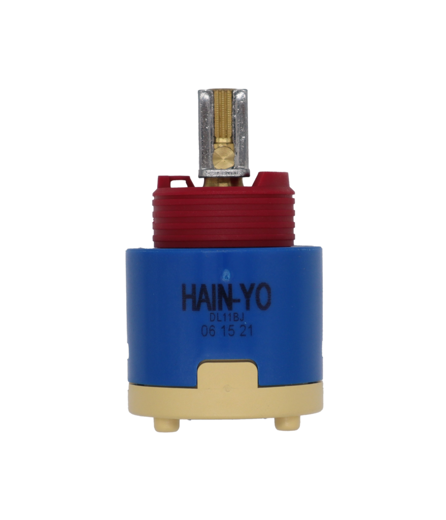 Blue and tan plastic cartridge with red limit stop brass and metal handle connection with blue rubber seal.