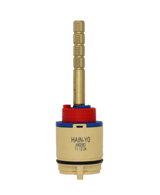 Tan plastic cartridge body with blue top red limit stop and bright brass stem with square broach black o-ring and black bottom seals.