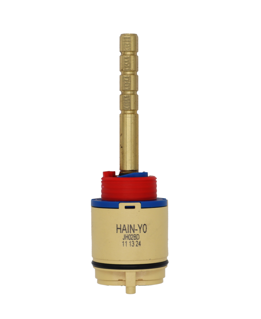 Tan plastic cartridge body with blue top red limit stop and bright brass stem with square broach black o-ring and black bottom seals.