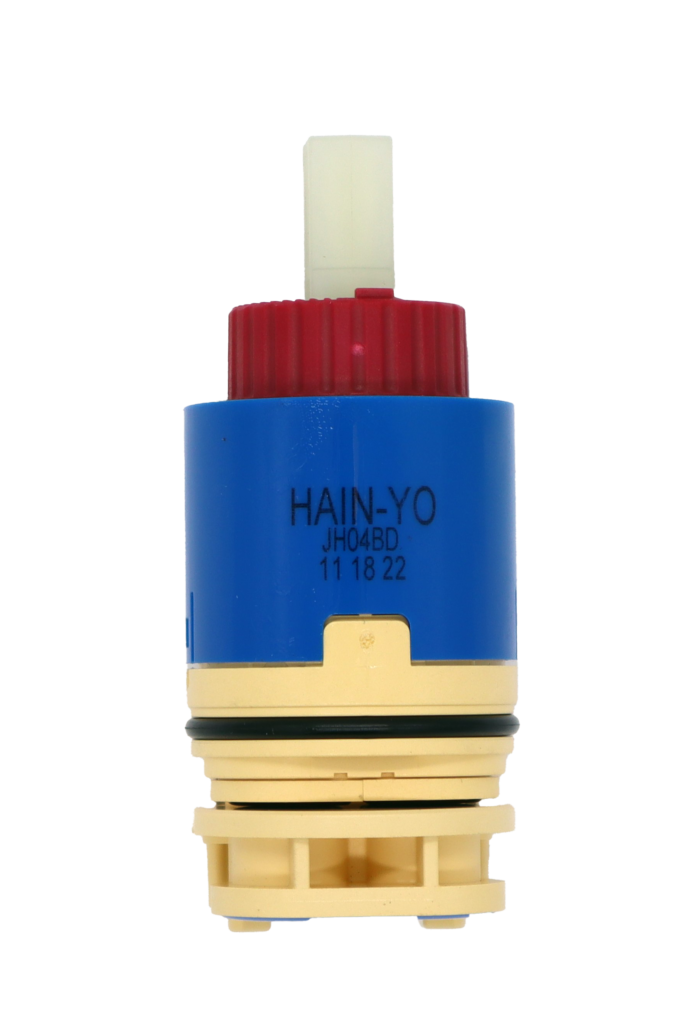 Blue and tan plastic cartridge with red limit stop and square white handle connection with black rubber o-ring and black and blue bottom seals.