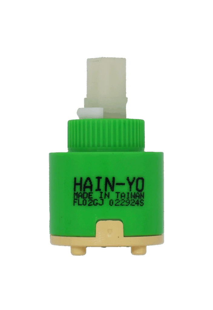 Green plactic cartridge with white square handle connection tan bottom with black seals.