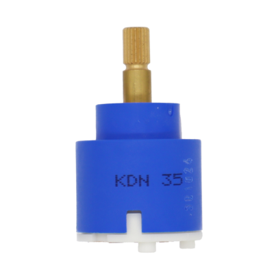 Blue and white plastic cartridge with brass handle connection red rubber seals and 2 alignment pegs.