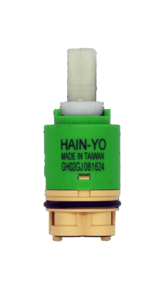 Lime green and tan plastic cartridge with white square handle connection black rubber o-ring and black bottom seals.