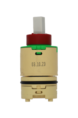 Tan plastic cartridge with green top with red limit stop with white square handle connection tan bottom balance with black o-ring and blue bottom seal.