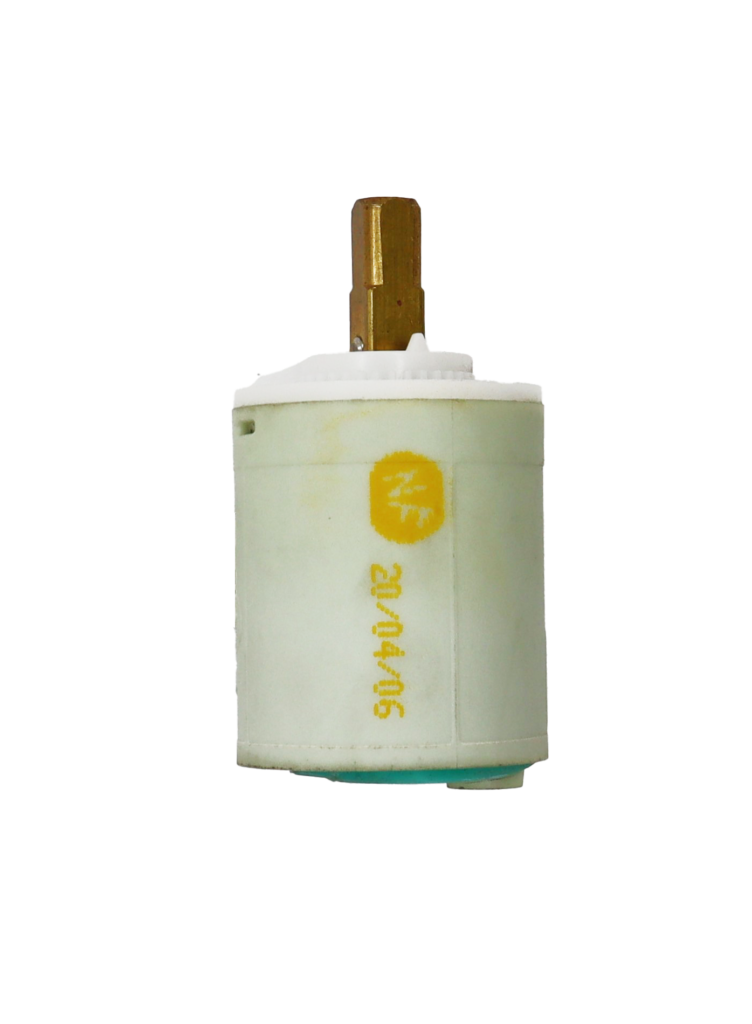 Light grey plastic cartridge with white handle stop brass handle connection and green rubber seal.
