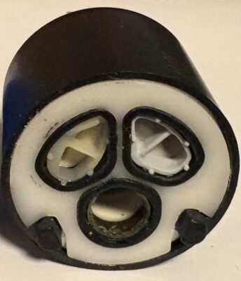 Old version of cartridge with black plastic body white plastic bottom adn black o-rings.