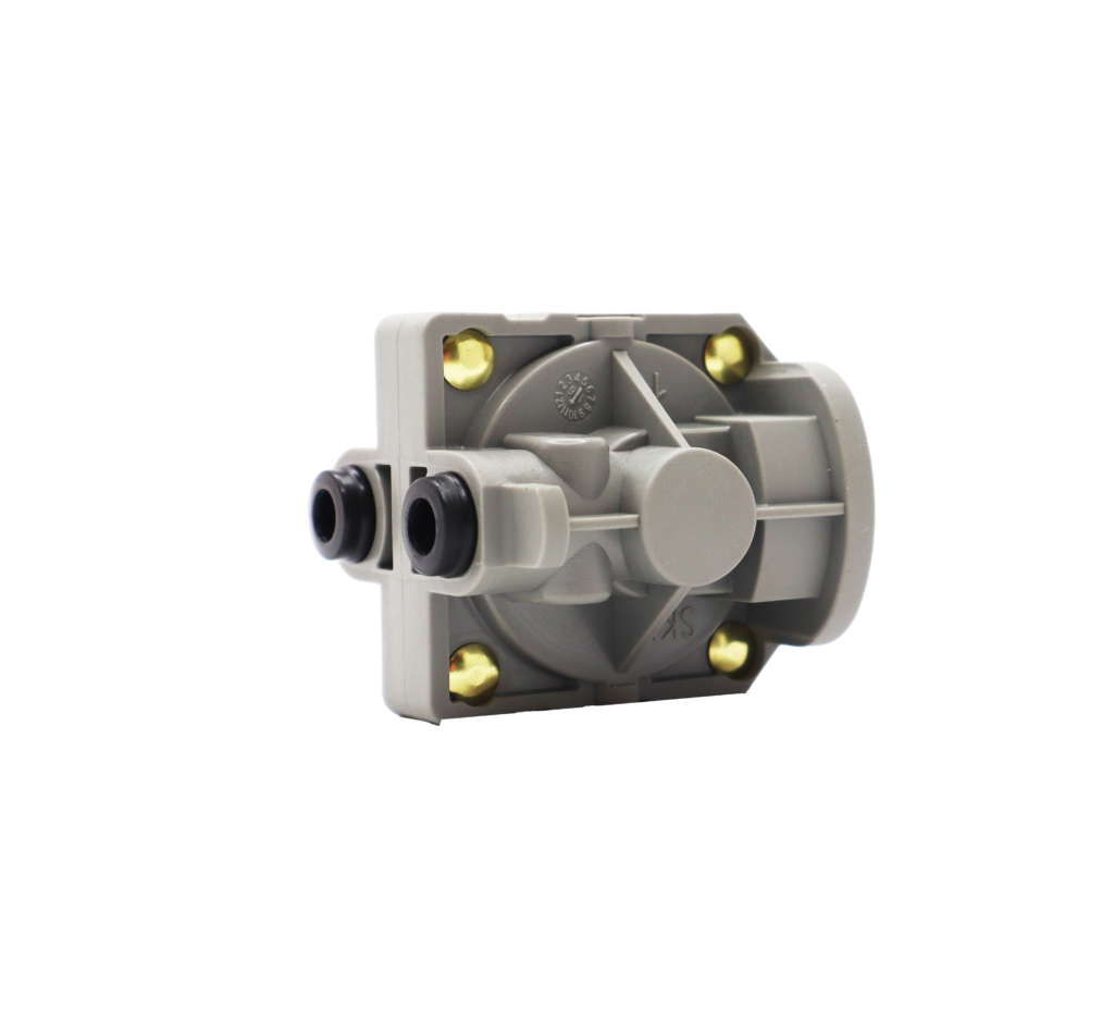 Grey plastic balancing cartridge with brass screws and black rubber seals.