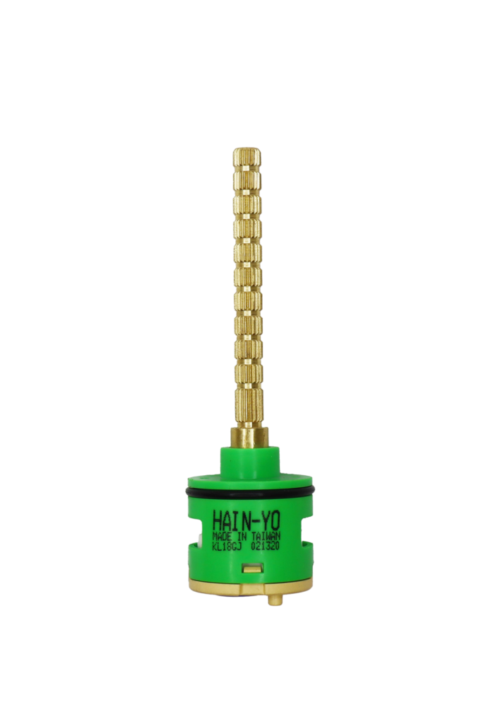 Bright brass stem with green plastic body tan bottom with blue seal.