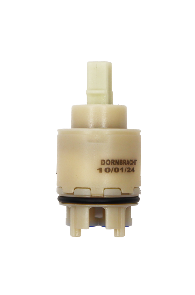 Beige plastic cartridge with white square handle connection with black rubber o-ring with blue rubber seals dornbracht printed on the cartridge.