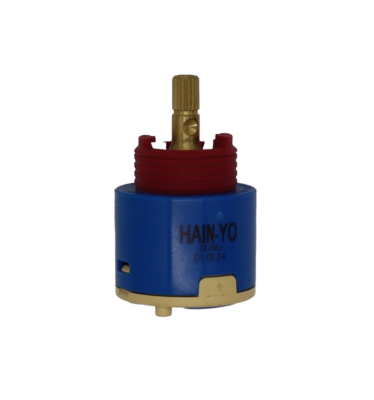 Blue plastic cartridge with red limit stop with brass stem tan bottom and blue rubber seal.