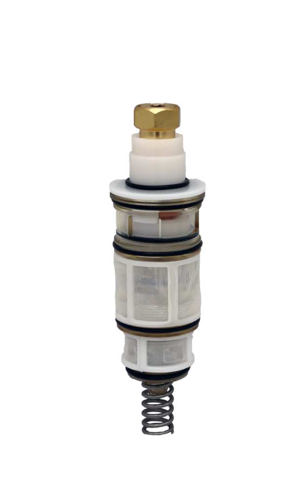 White plastic cartridge with brass top black rubber o-rings and metal spring.