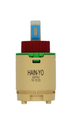 Tan plastic cartridge with green top red limit stop white square handle connection with blue clip and blue bottom seal.