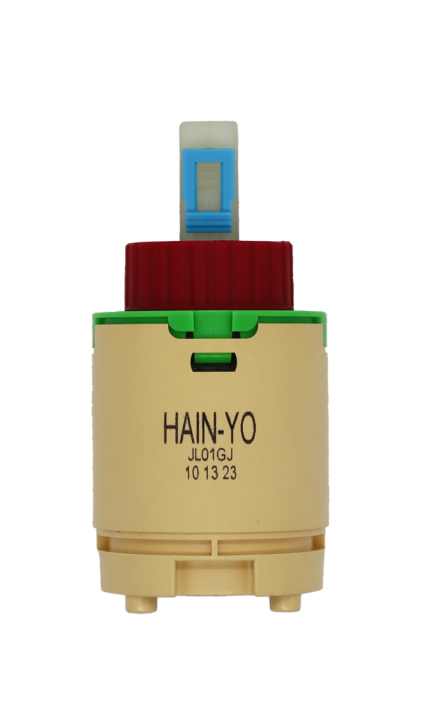 Tan plastic cartridge with green top red limit stop white square handle connection with blue clip and blue bottom seal.
