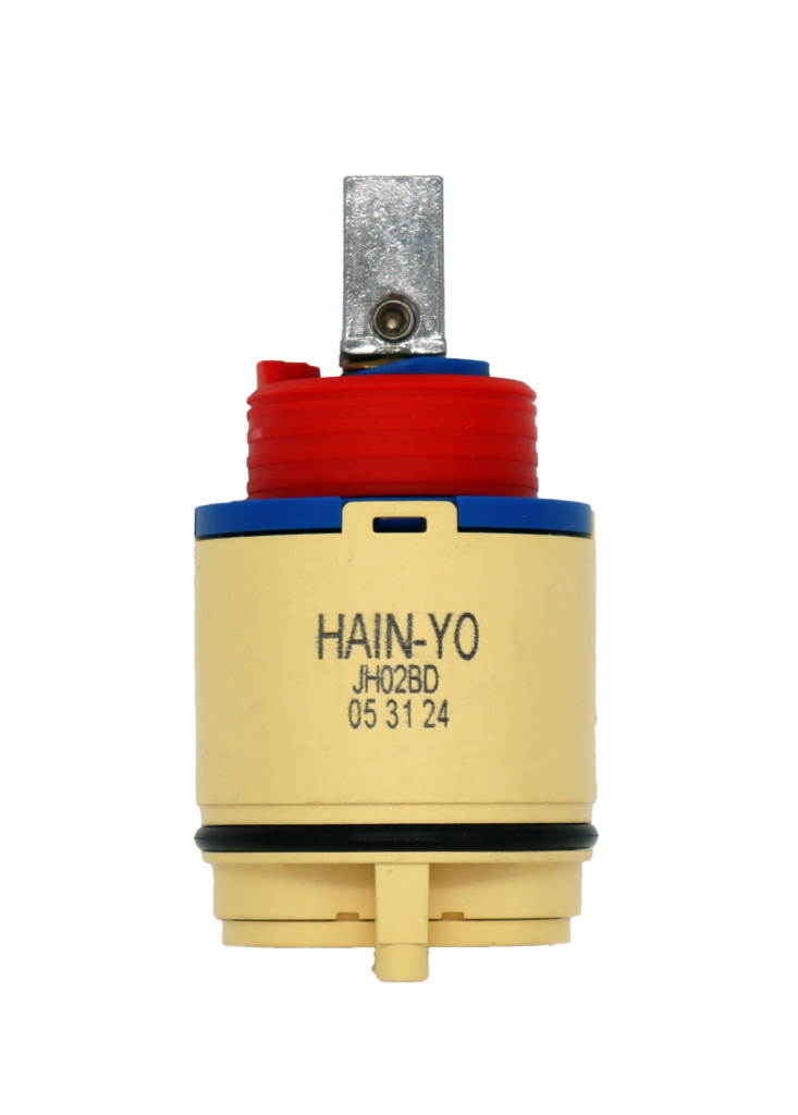 Tan plastic cartridge with blue top red limit stop metal handle adapter with black oring and bottom seal.
