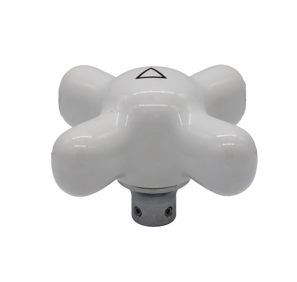 Bright white porecelain x cross handle with metal broach.