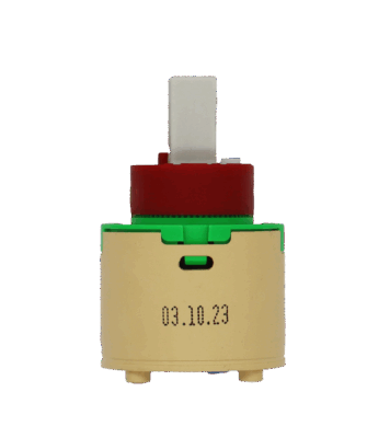 Tan plastic cartridge with green top red limit stop white square handel connection and blue rubber seal.