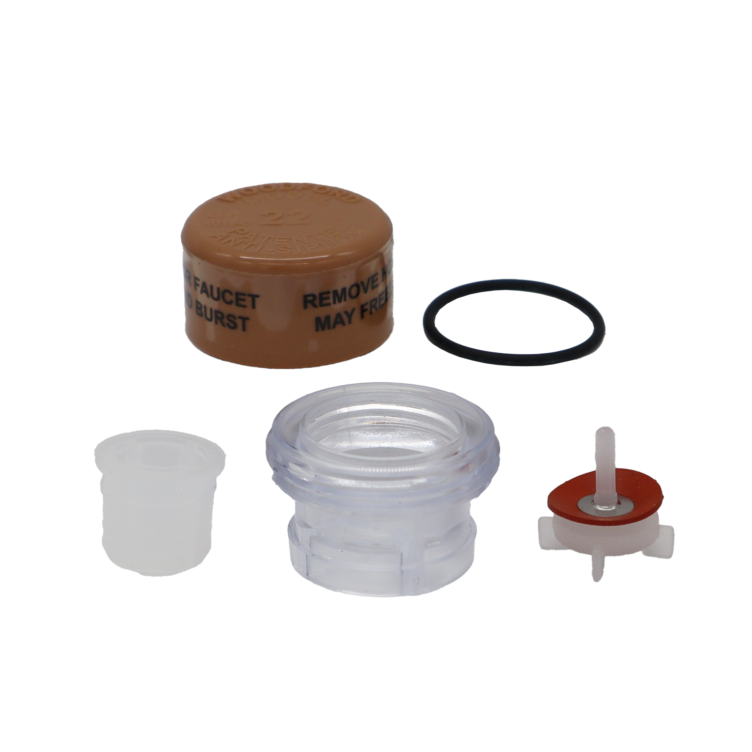 Tan plastic cap with clear plastic vacuum breaker black rubber o-ring and white plastic plunger with red rubber washer.
