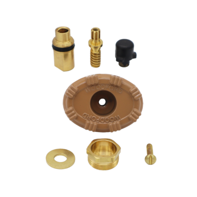 Tan metal hanlde with brass drain assembly washer screw and packing nut with black rubber plunger.